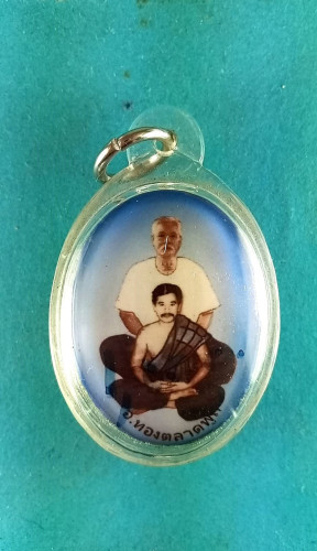  ล็อกเก็ตซัอนหลังผงพุทธคุณตะกรุด1ดอก 