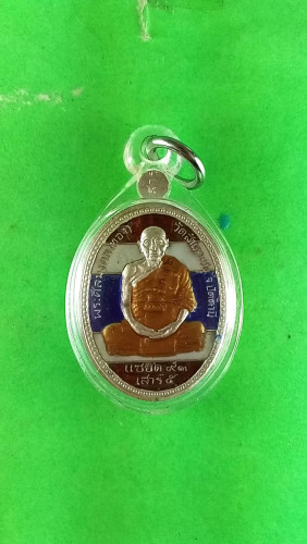 เหรียญไข่เต็มองค์เงินลงยาหลังลพ.โต๊ะหักปี53