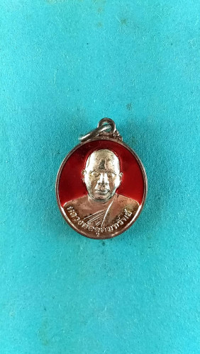 เหรียญลงยารูปไข่เล็กหลังพระพุทธปี54มีจาร 