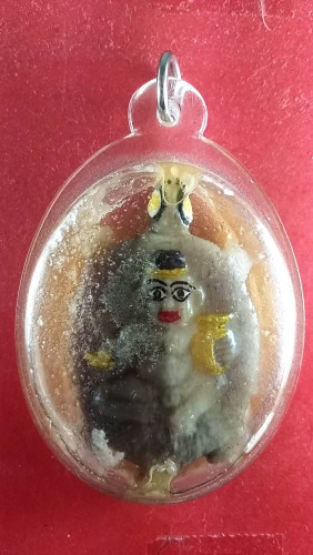 รูปเหมือนกุมารทองแกละจากกระดูกช้างมีจารหน้าหลังแช่น้ำมันพราย 