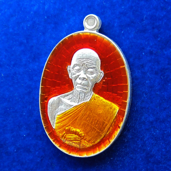 เหรียญรูปไข่ พิมพ์ครึ่งองค์ หลังยันต์ หลวงพ่อคูณ วัดบ้านไร่ รุ่นปาฏิหาริย์ EOD เนื้อเงินลงยาสีส้ม