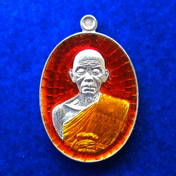 เหรียญรูปไข่ พิมพ์ครึ่งองค์ หลังยันต์ หลวงพ่อคูณ วัดบ้านไร่ รุ่นปาฏิหาริย์ EOD เนื้อเงินลงยาสีส้ม 1