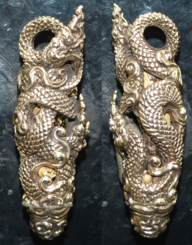 ตะกรุดนาคบาศ (ด้านในตะกรุดหนังงูเหลือม) เนื้อทองขาว รุ่นมงคลนาคราช หลวงปู่คำบุ วัดกุดชมภู 2557