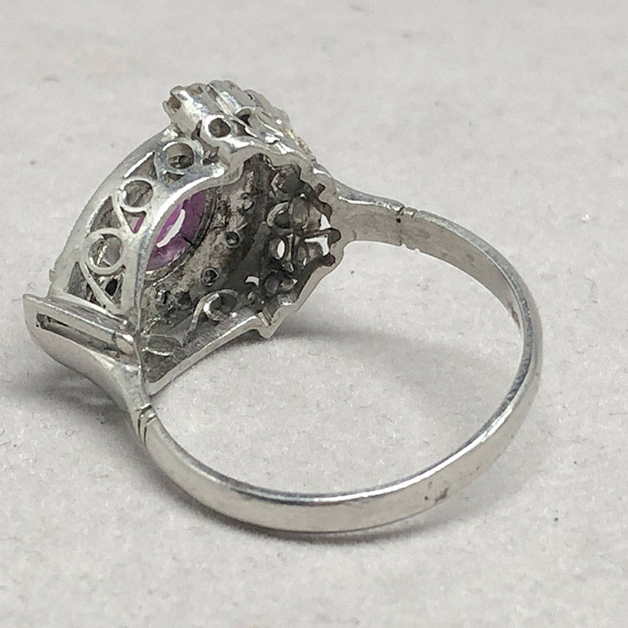 A gold ring set with 22 rose-cut diamonds totaling 0.66 carats, and adorned with genuine faceted rub 3