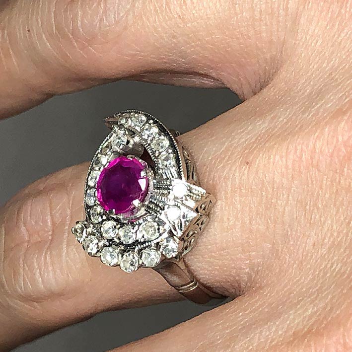 A gold ring set with 22 rose-cut diamonds totaling 0.66 carats, and adorned with genuine faceted rub 4